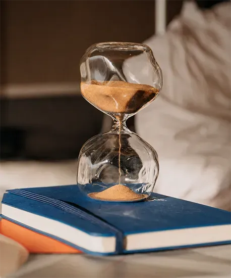 Hourglass on a desk, deadline pressure on an engineering programme