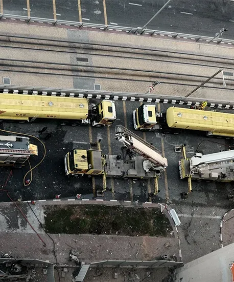 Aerial view of freight trucks queuing at a road terminal