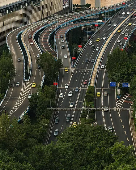 Multi-level motorway interchange handling live traffic across many lanes