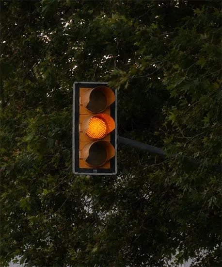 Traffic light on amber at an urban intersection