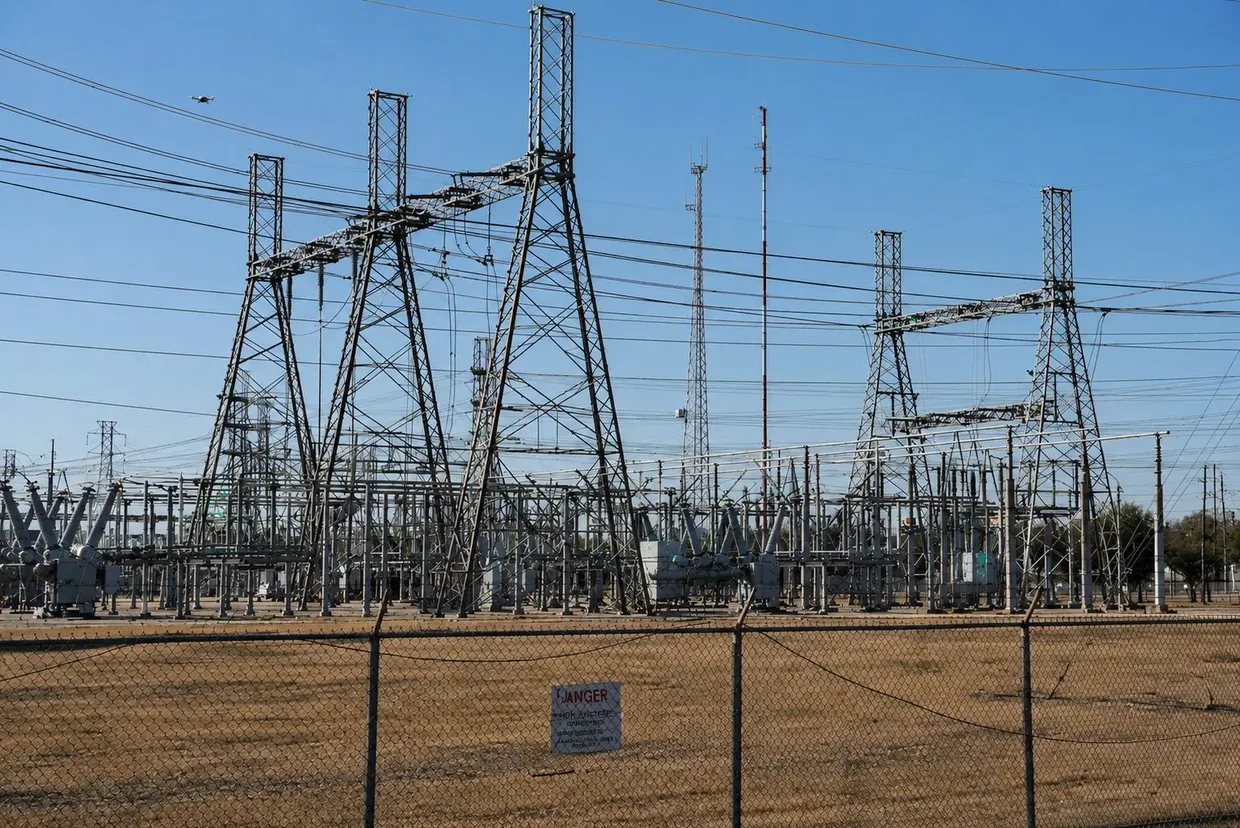 High-voltage transmission towers at an electrical substation