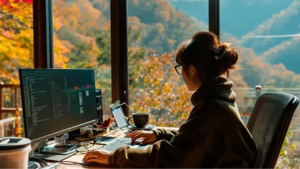 Developer cleaning up and refactoring code at a workstation