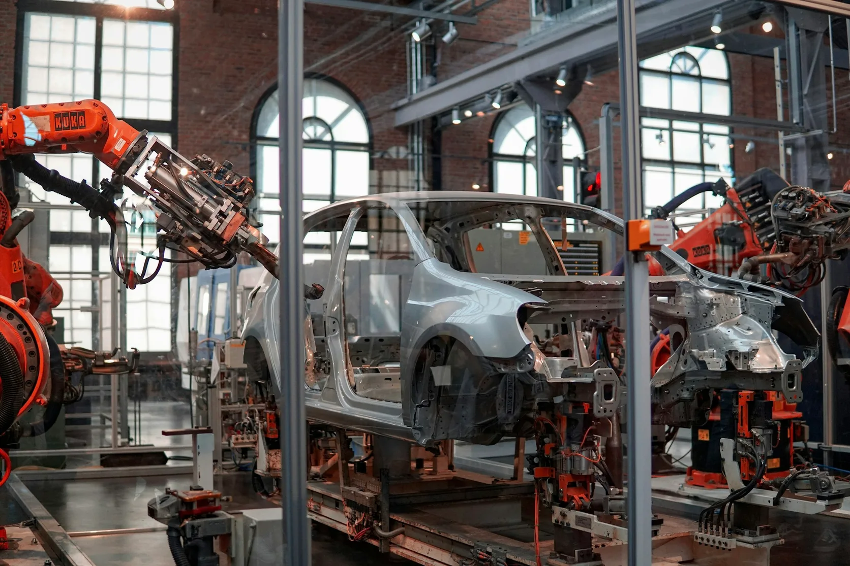 Automotive body line with welding robots, a cell control cabinet, inspection fixtures and cabling